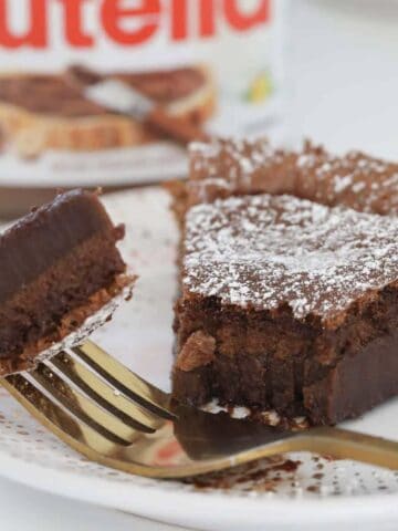A half eaten moist and gooey Nutella cake made with 2 ingredients.