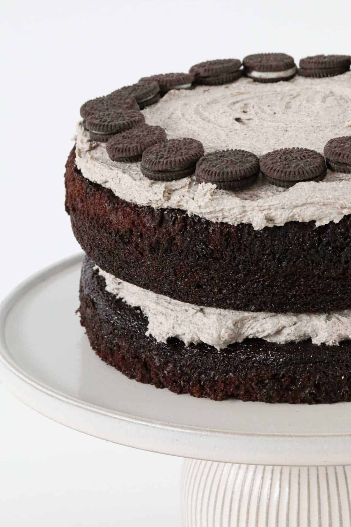 Side view of Oreo mud cake on a cake stand.