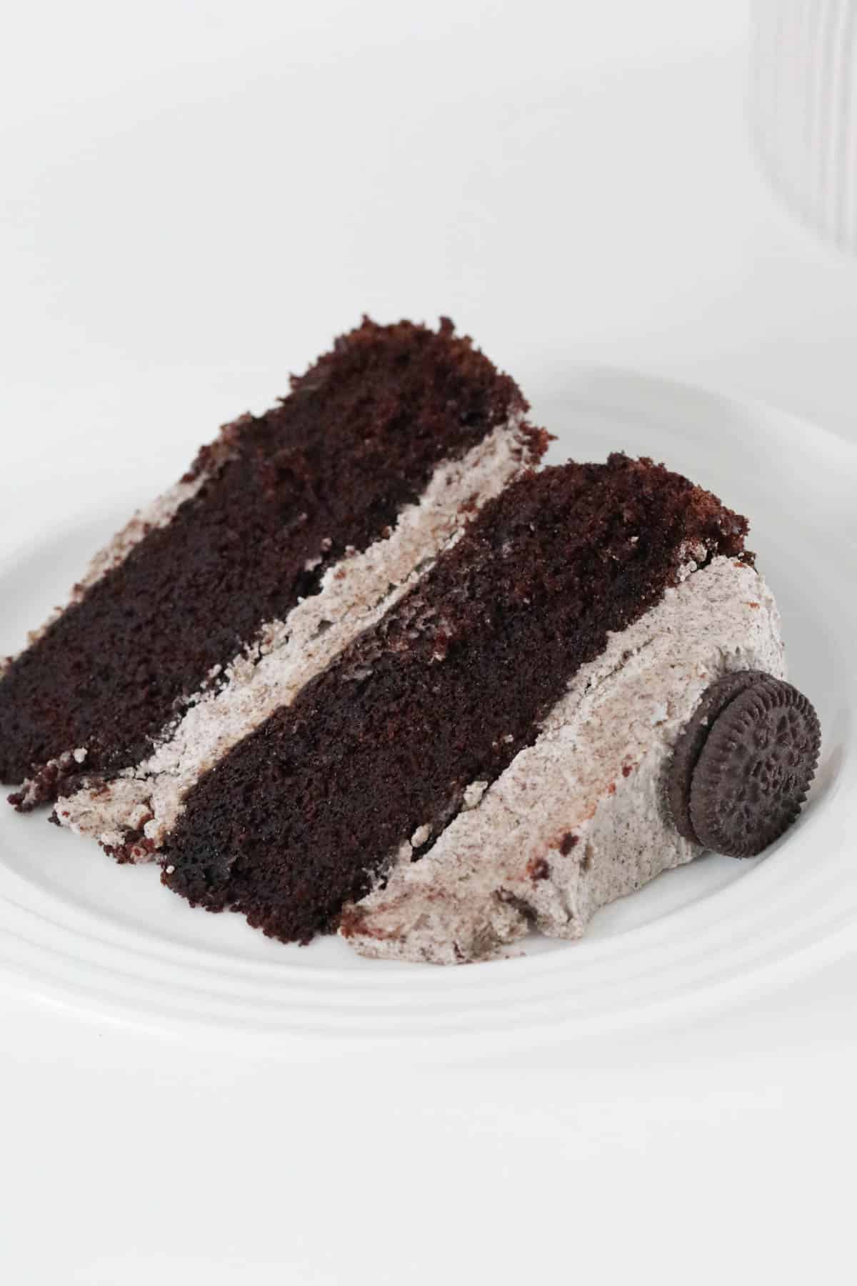 A slice of Oreo mud cake on a white plate.