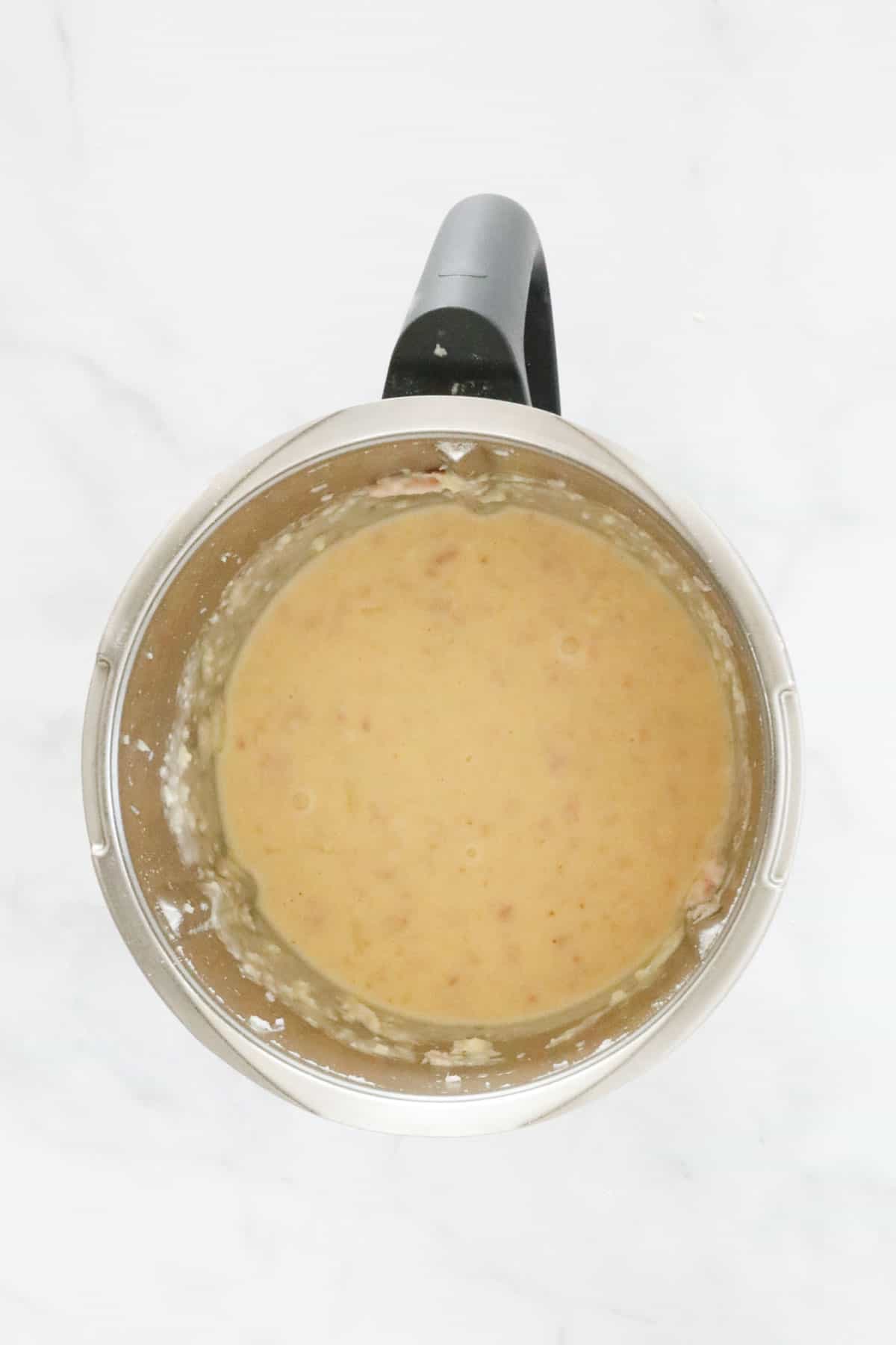 Egg mixture in a stainless steel bowl.