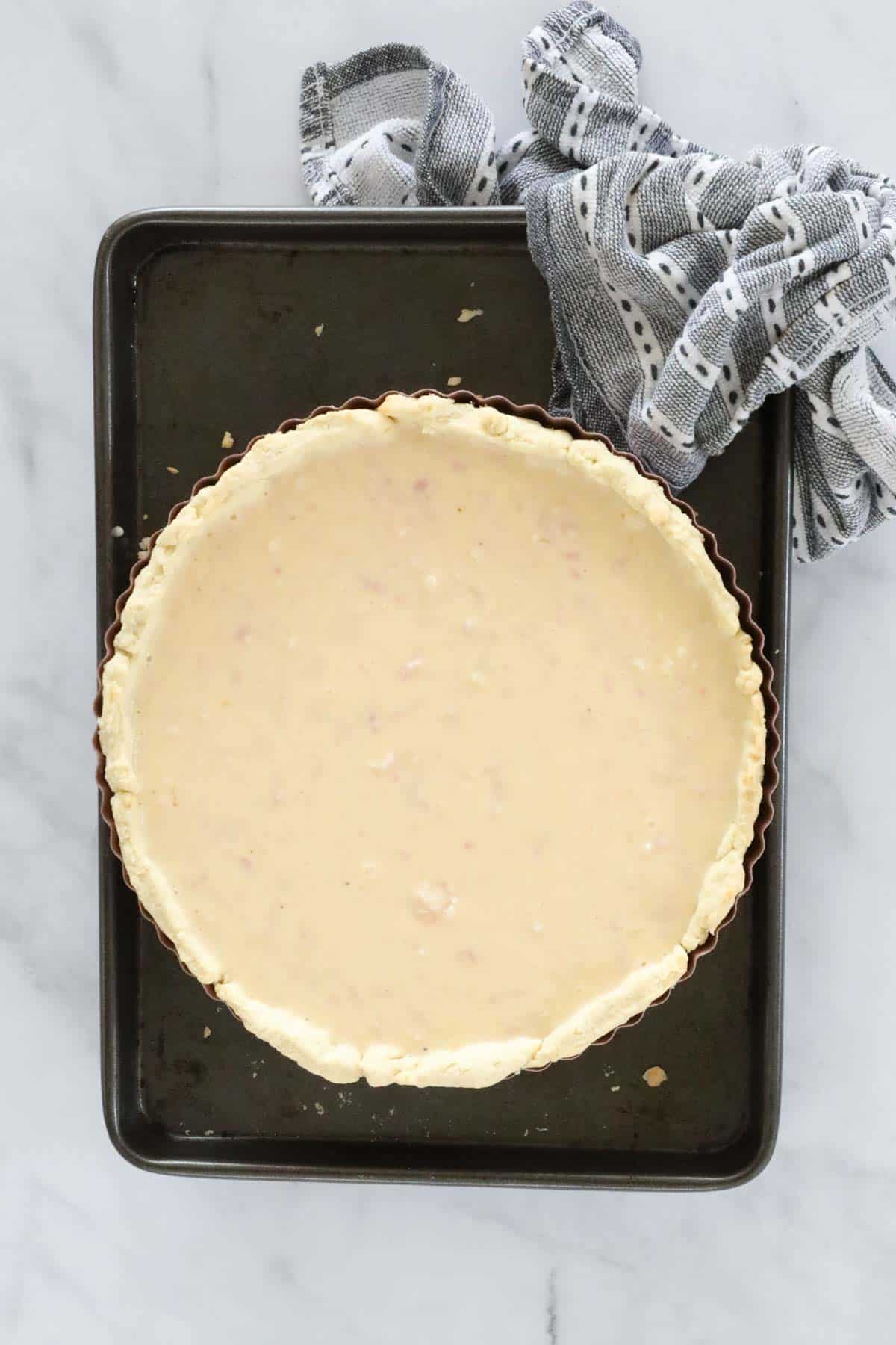 Thermomix Quiche Lorraine mixture in a round pastry flan tin..