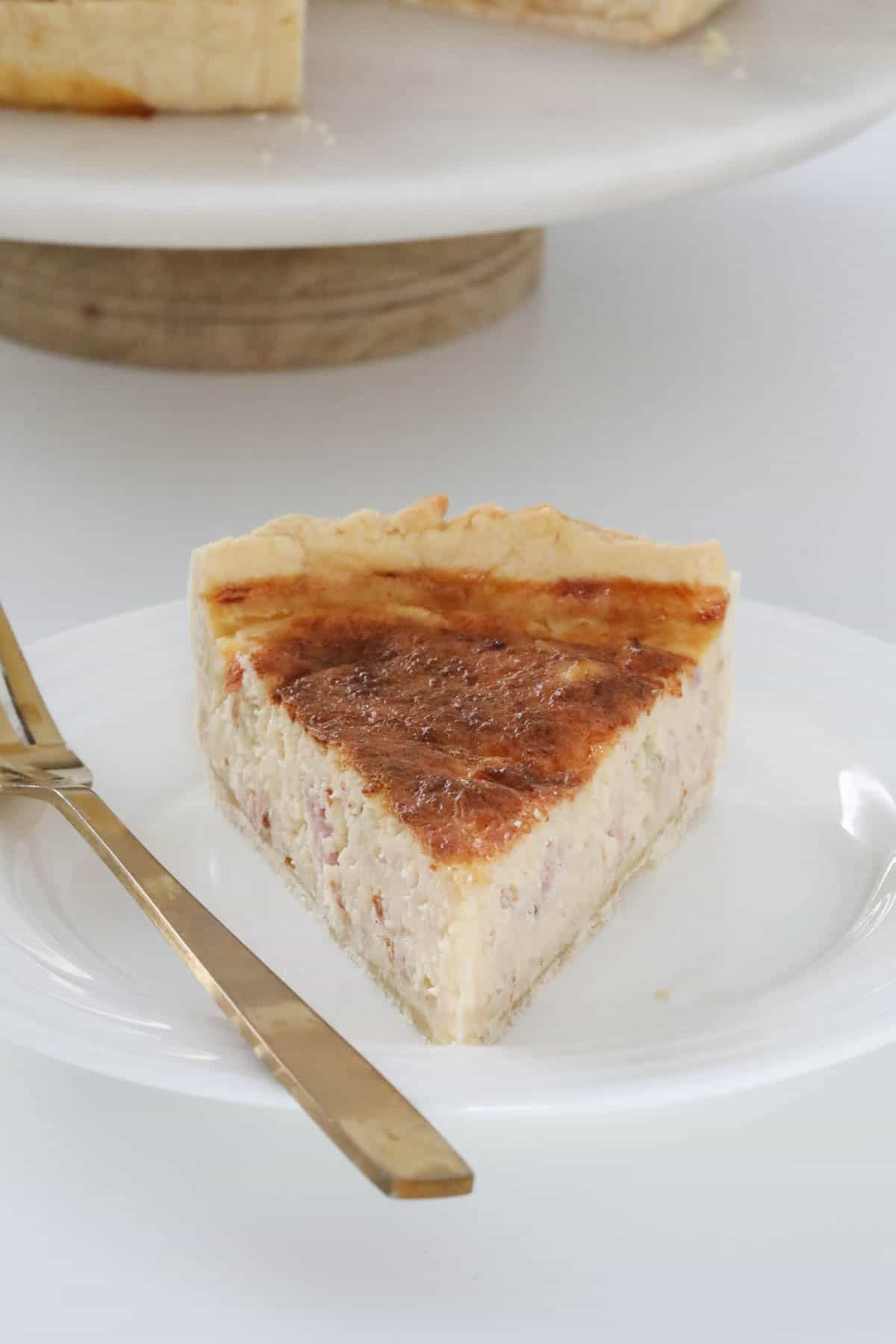 A piece of Thermomix Quiche Lorraine on a plate.