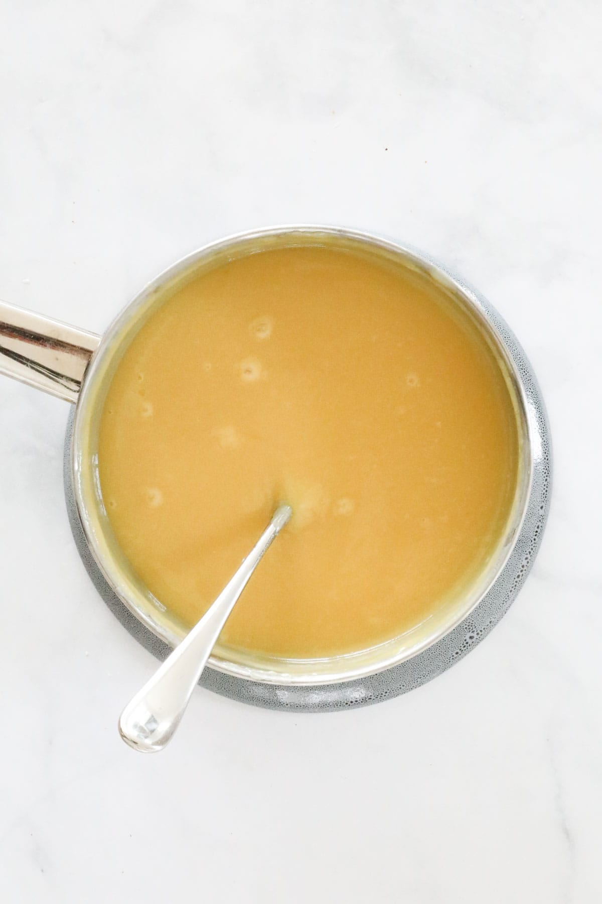 Caramel filling in a saucepan.
