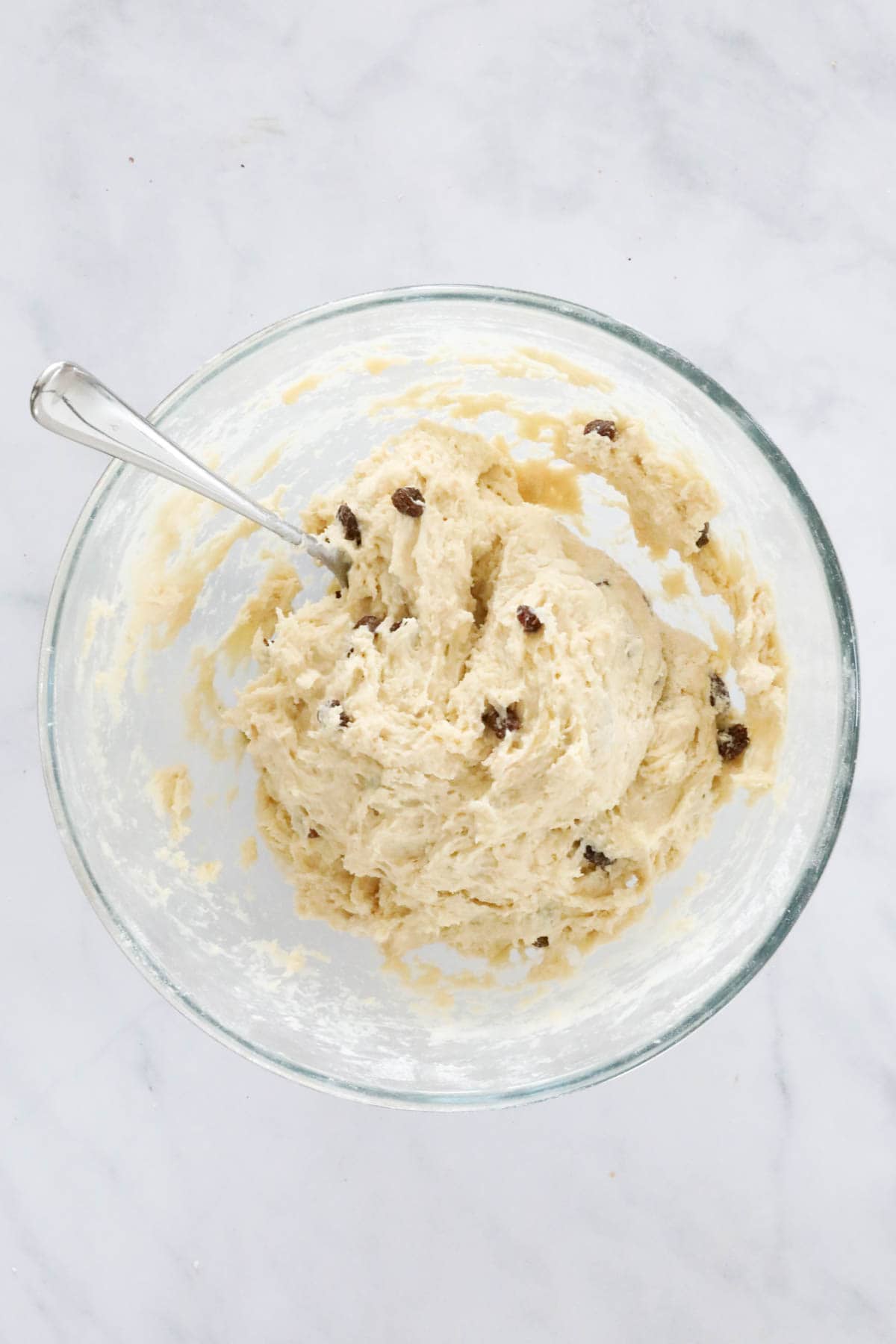 The mixed finger bun dough in a mixing bowl.