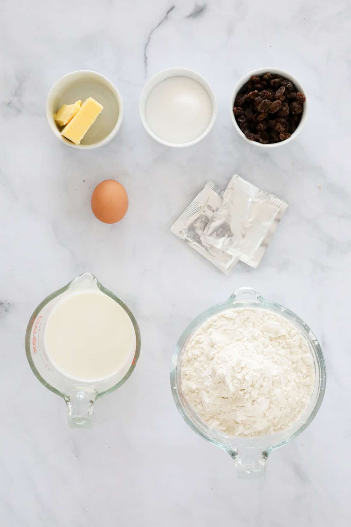 ingredients needed to make finger buns weighed out and placed in individual bowls.