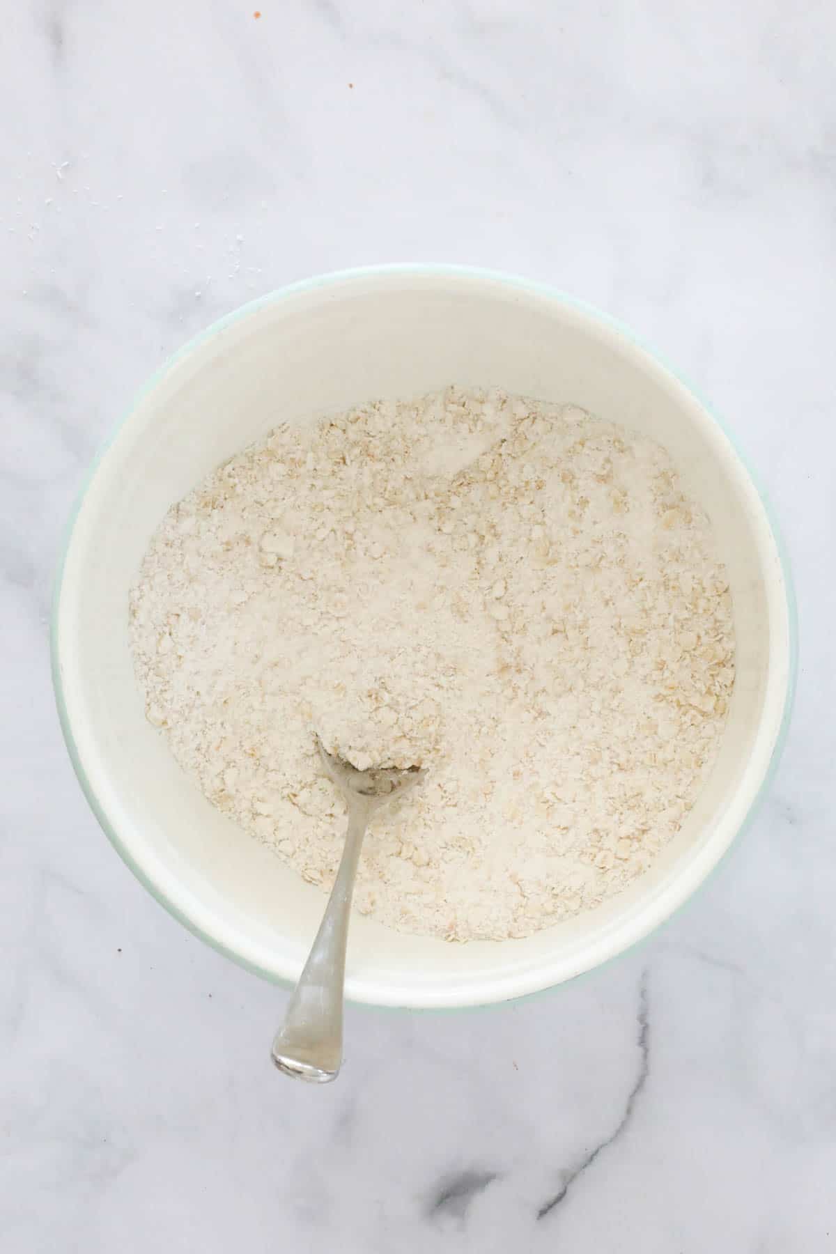 Flour, caster sugar, desiccated coconut mixed in a large bowl.