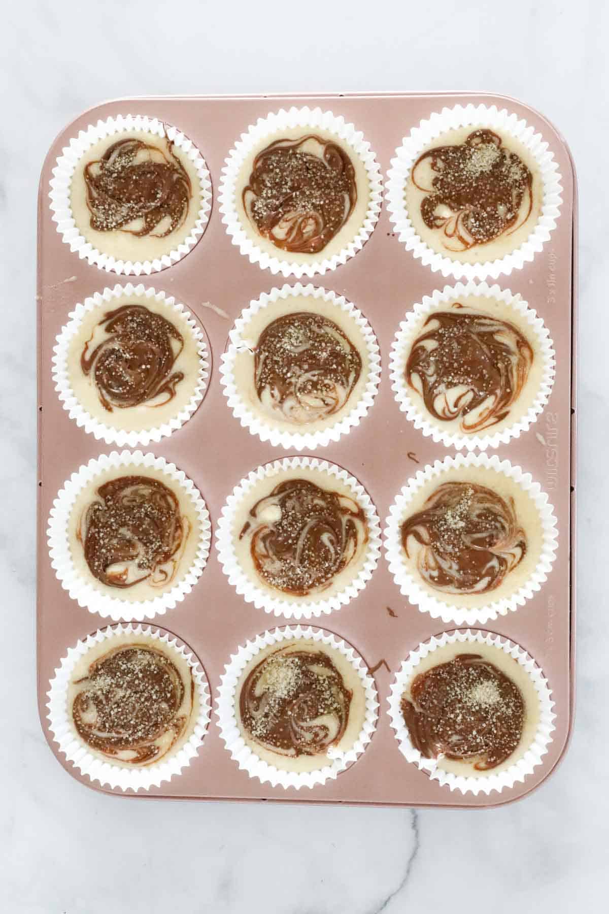 Nutella swirled through muffin batter and sugar sprinkled on top.