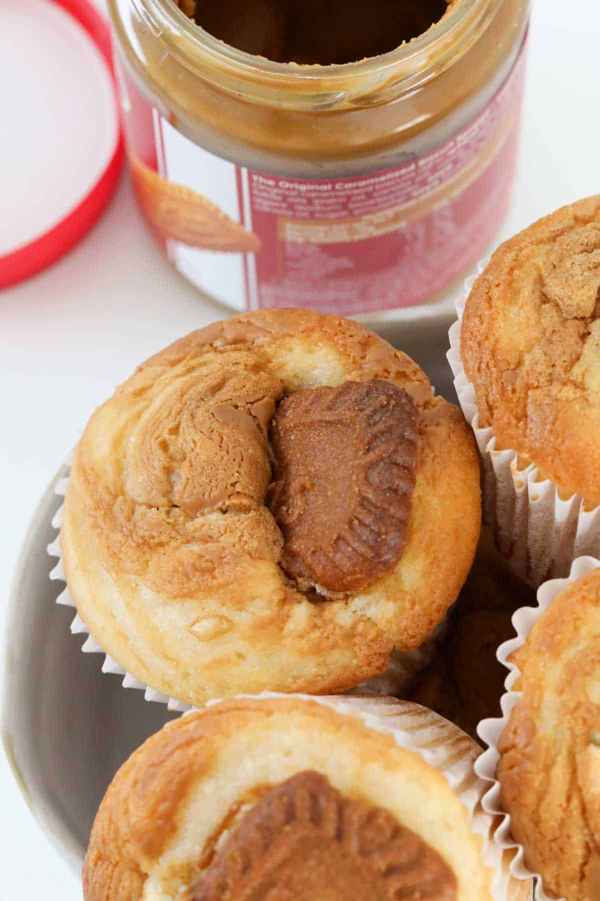 Muffins with a piece of Biscoff biscuit baked into the top.
