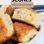 A batch of cheese scones piled into a bowl.