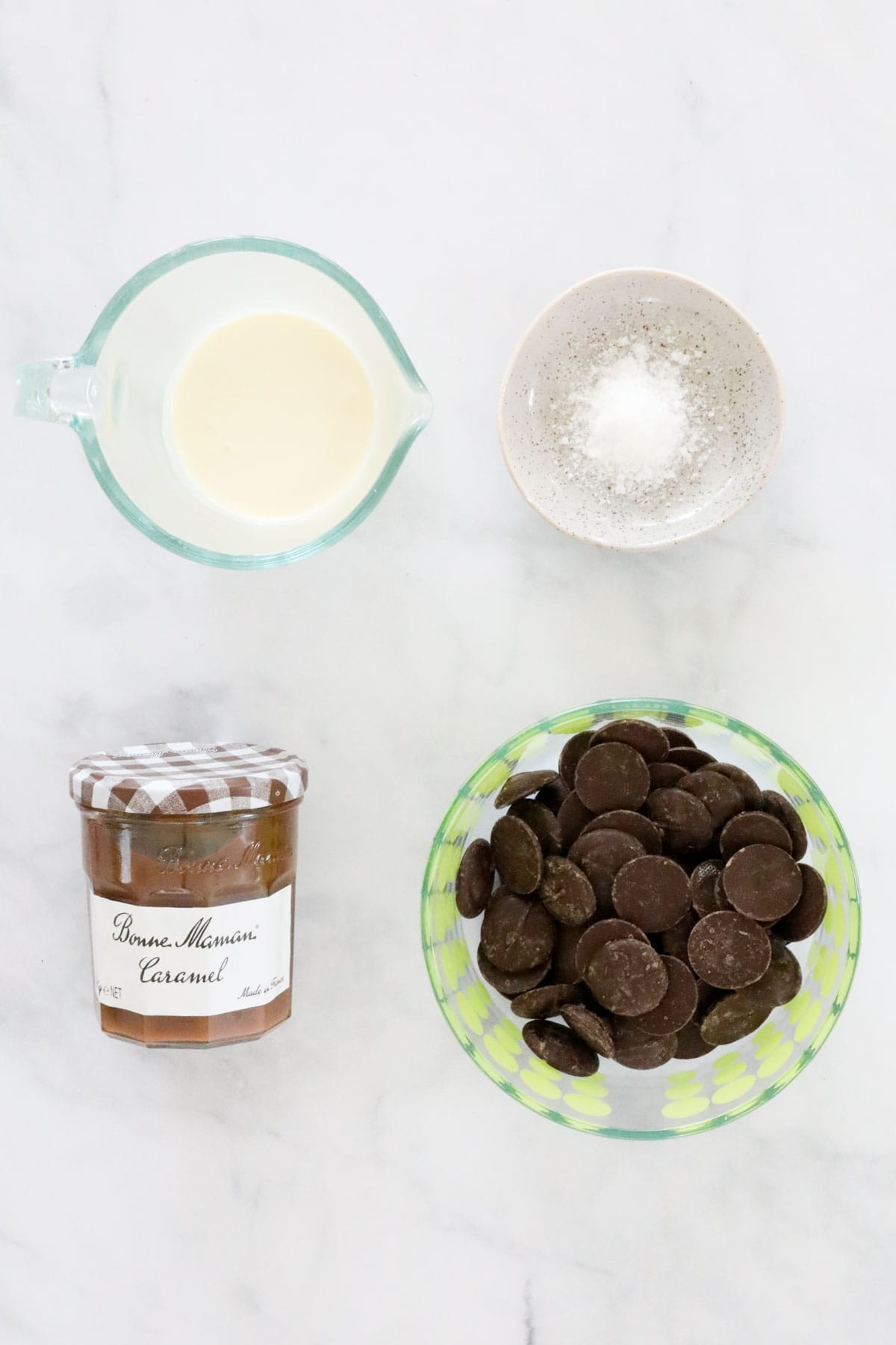 The four ingredients needed to make the truffles placed in individual bowls.