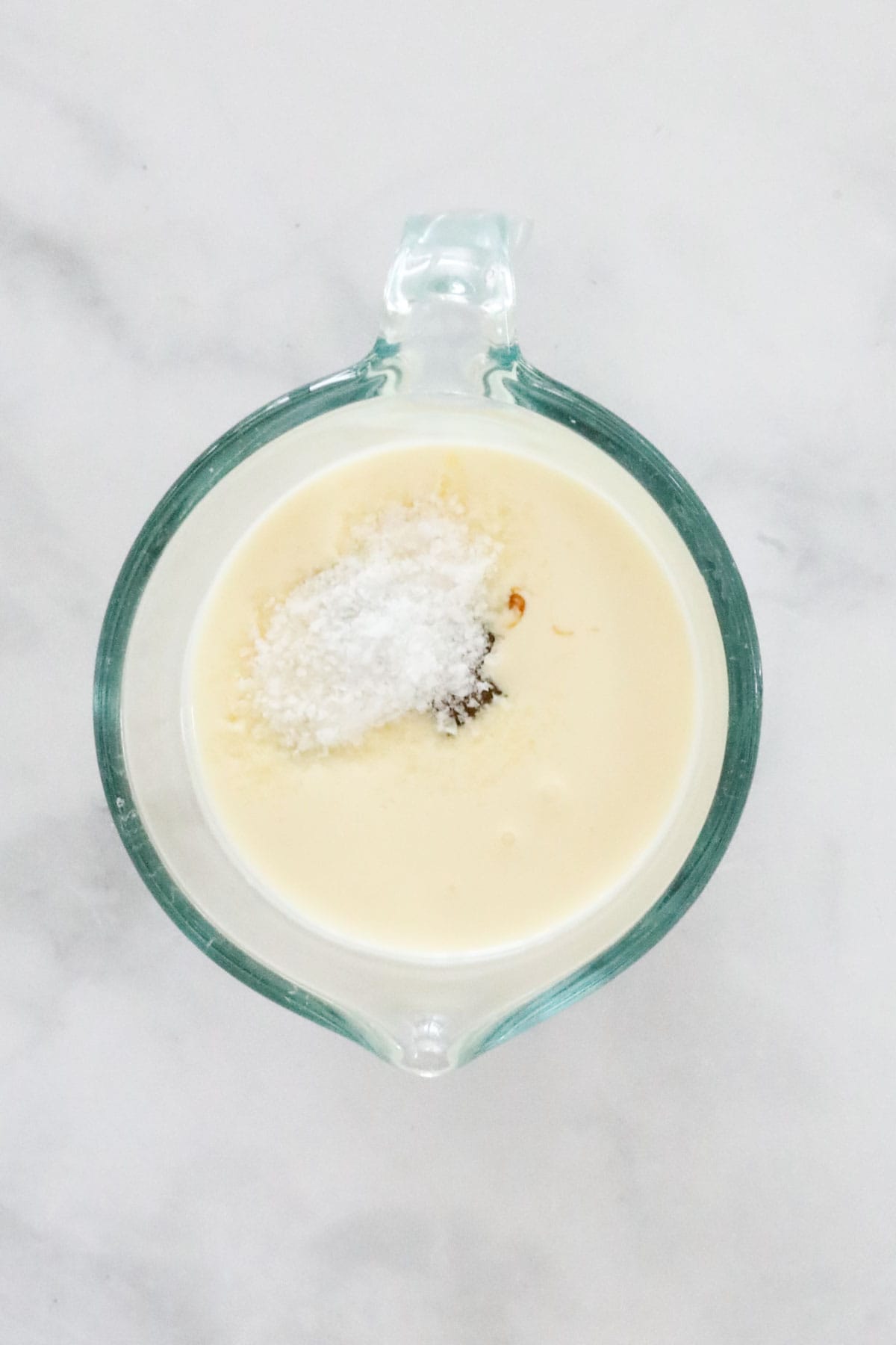 Cream, salt and caramel in a heatproof jug.