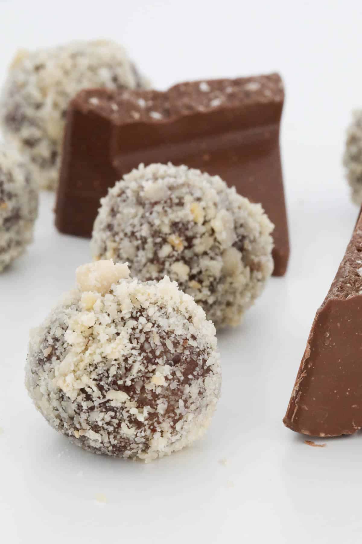 Close up of the finished truffle coated in finely chopped hazelnuts.