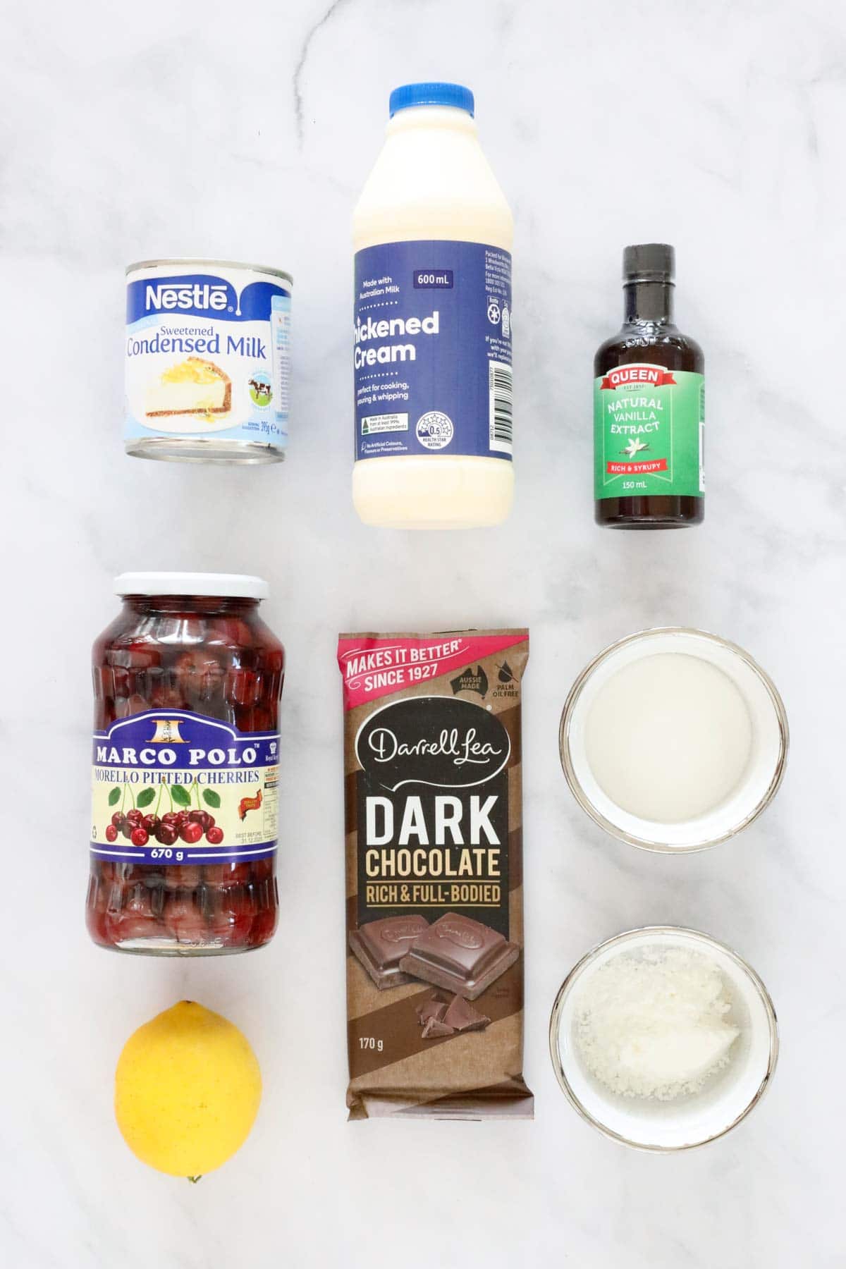 Ingredients required for homemade frozen dessert set out on a bench top.