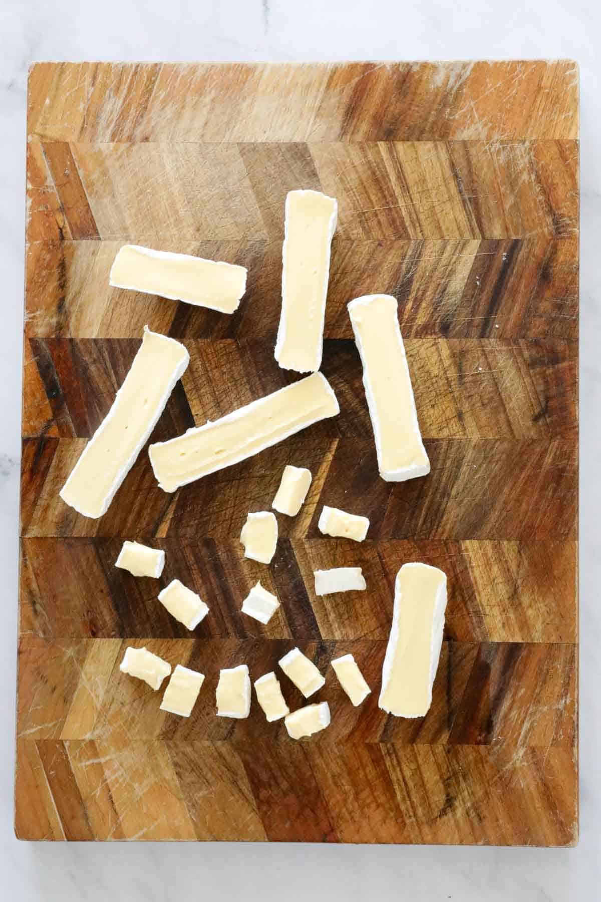 A round of brie cut into little pieces