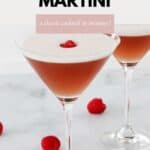 Two glasses filled with a pink martini and a raspberry.