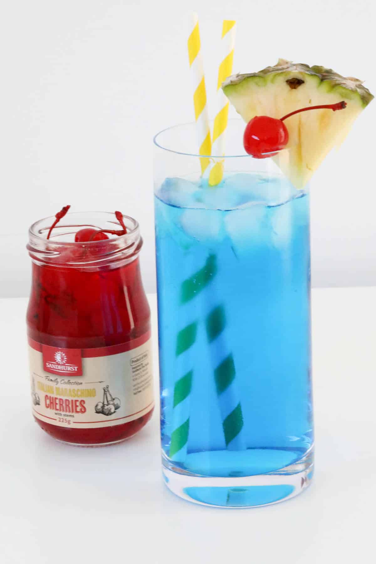 Vodka, blue curacao and lemonade in a tropically decorated glass.