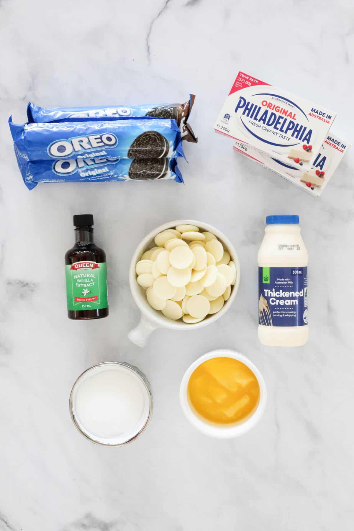 Ingredients for no-bake cheesecake set out on a bench top.
