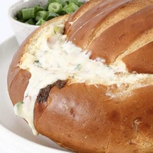 A cob loaf filled with a gooey, cheesy, creamy and bacon dip.