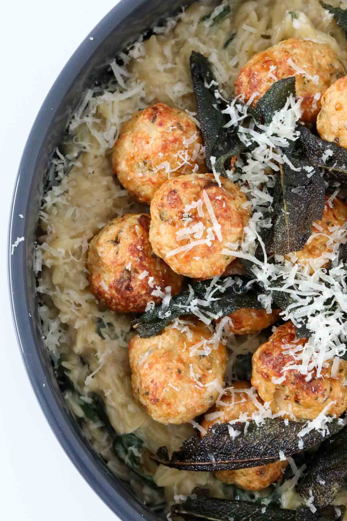 Baked chicken meatballs served on a bed of creamy risoni with finely grated parmesan sprinkled on top.