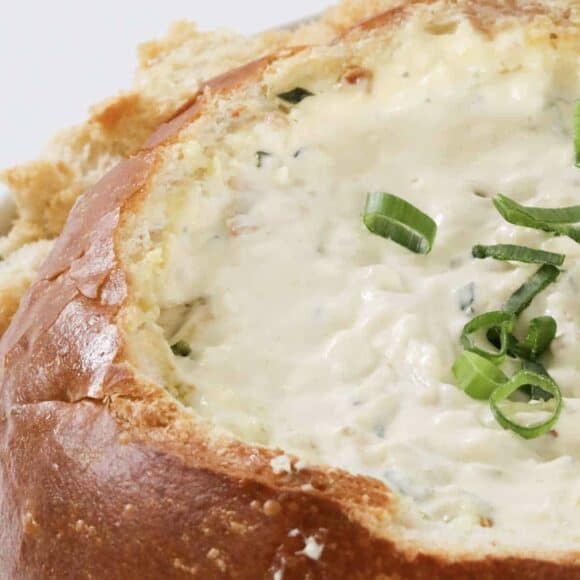 An oozy, gooey, cheesy cob loaf filled with bacon and cheese.