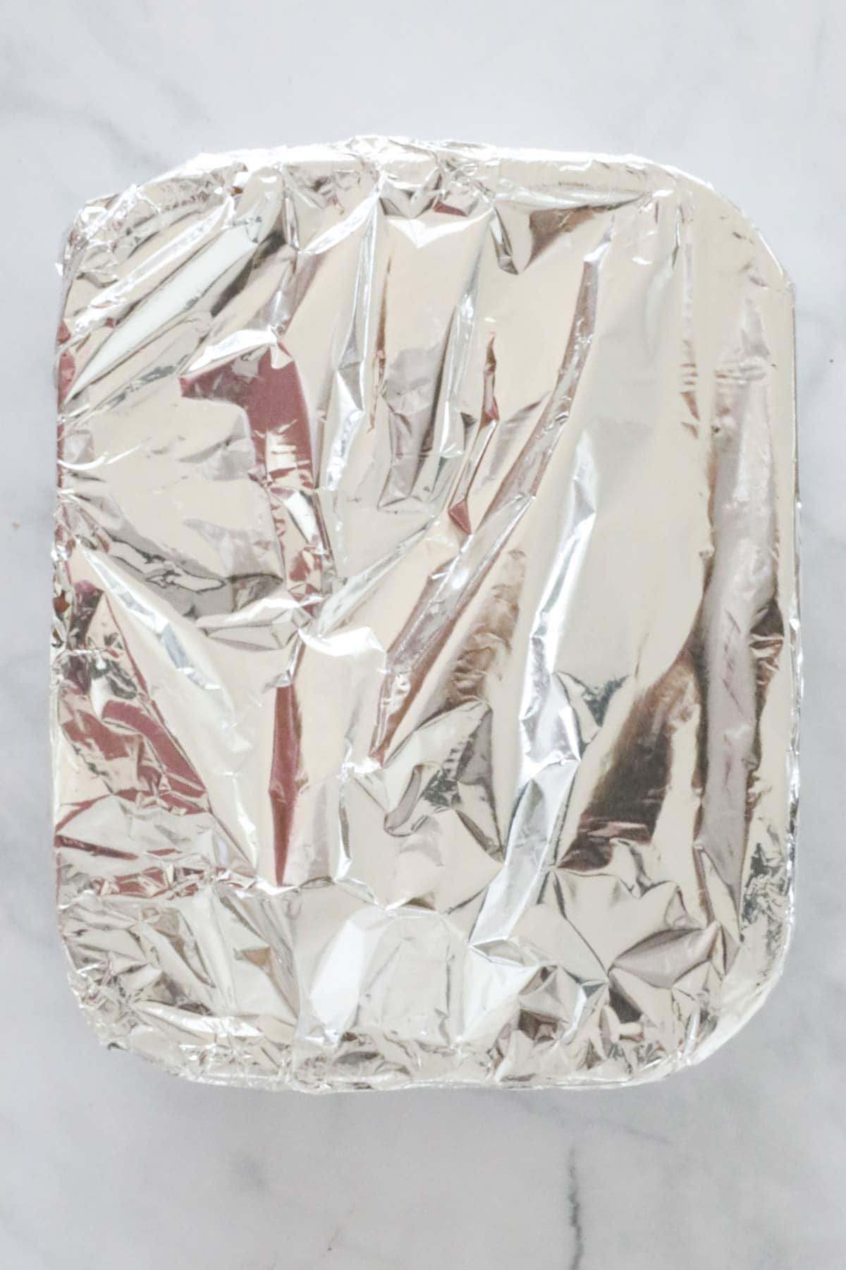 Foil placed over the top of baking dish.