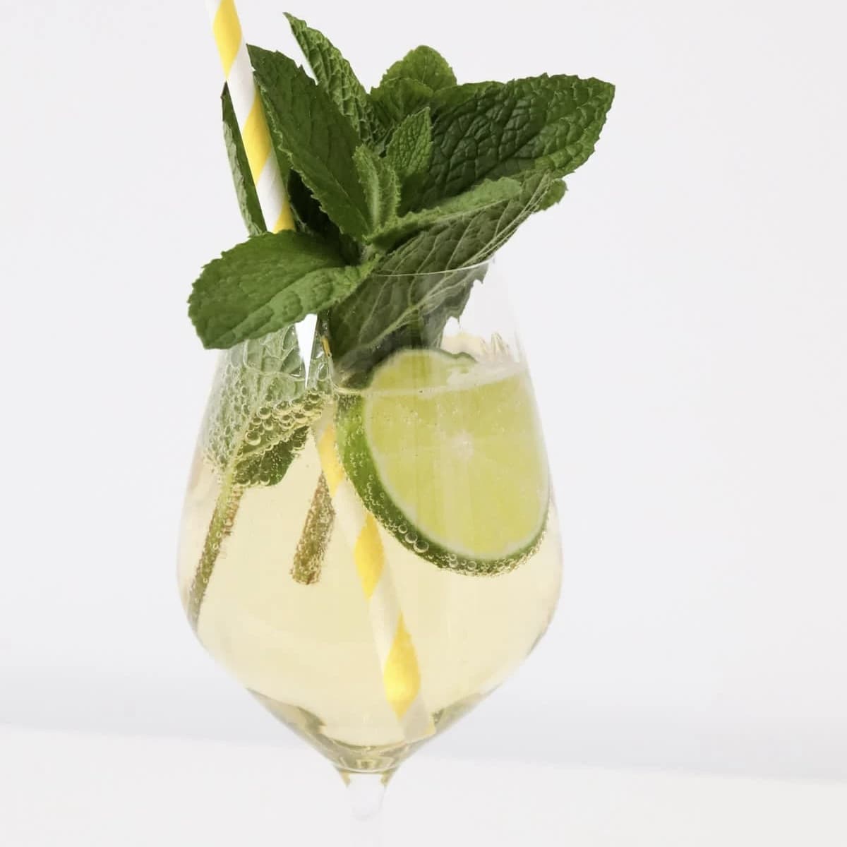 A classic elderflower cocktail Hugo Spritz with mint and lime.