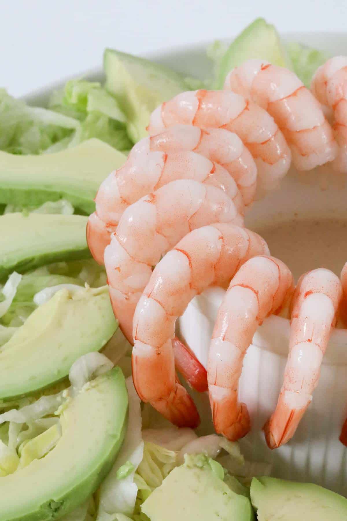 Close up of prawn salad served on serving platter.