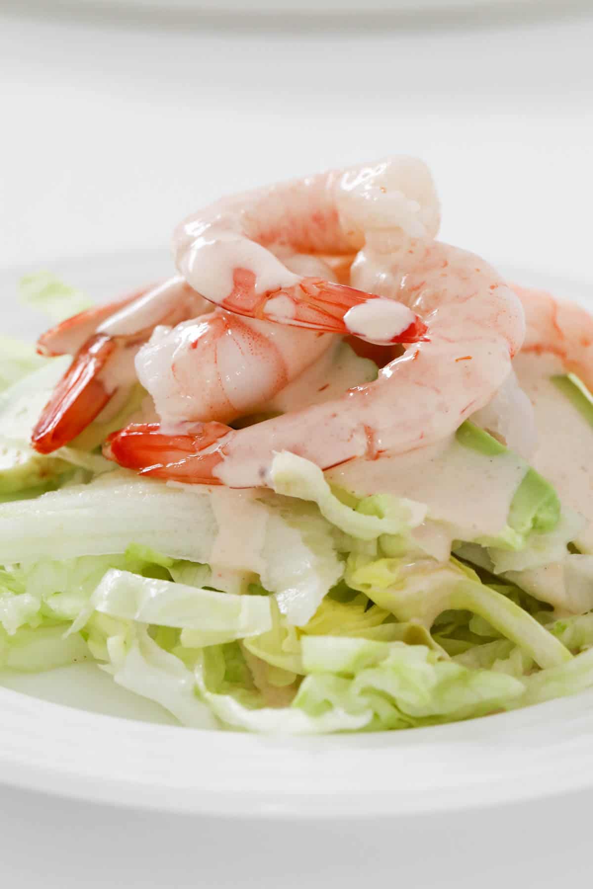 Prawn cocktail salad on a white serving plate.