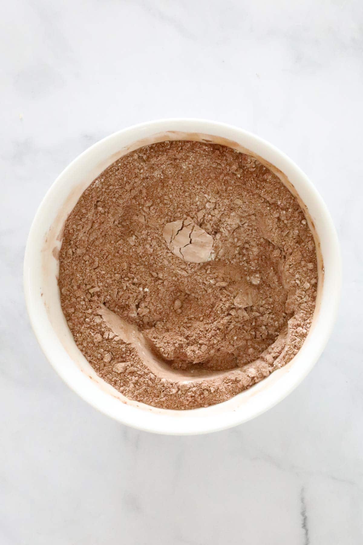 Cocoa powder and flour in a mixing bowl.