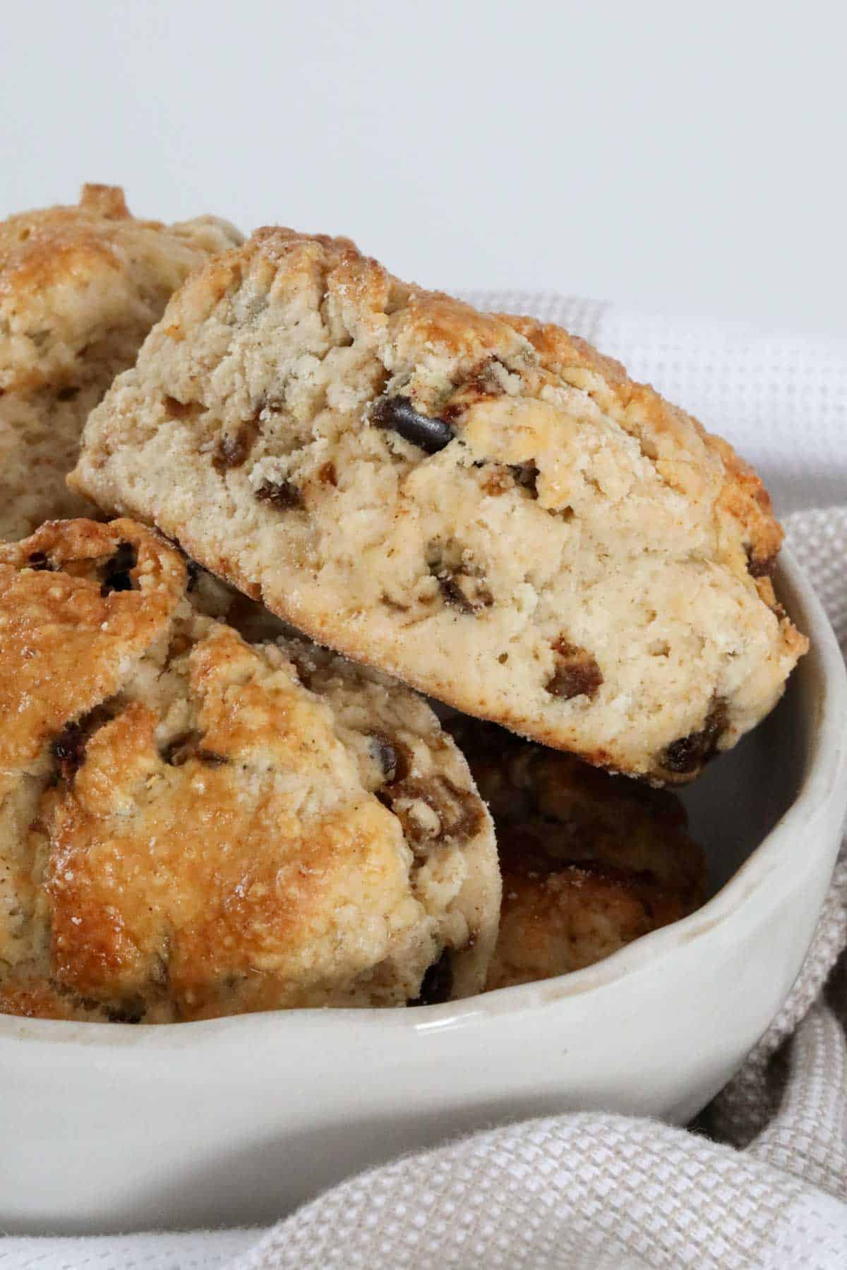 A batch of scones piled in to a bowl.