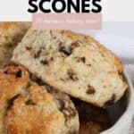 A batch of date scones piled in a bowl.