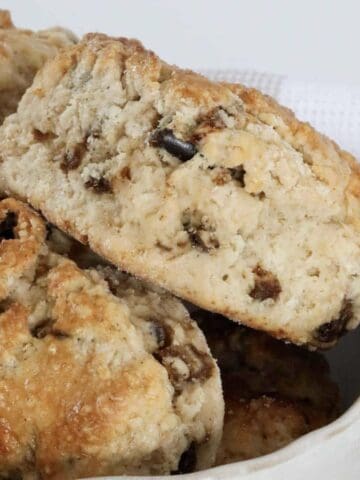 A baked scone with chunks of dried pitted dates throughout.