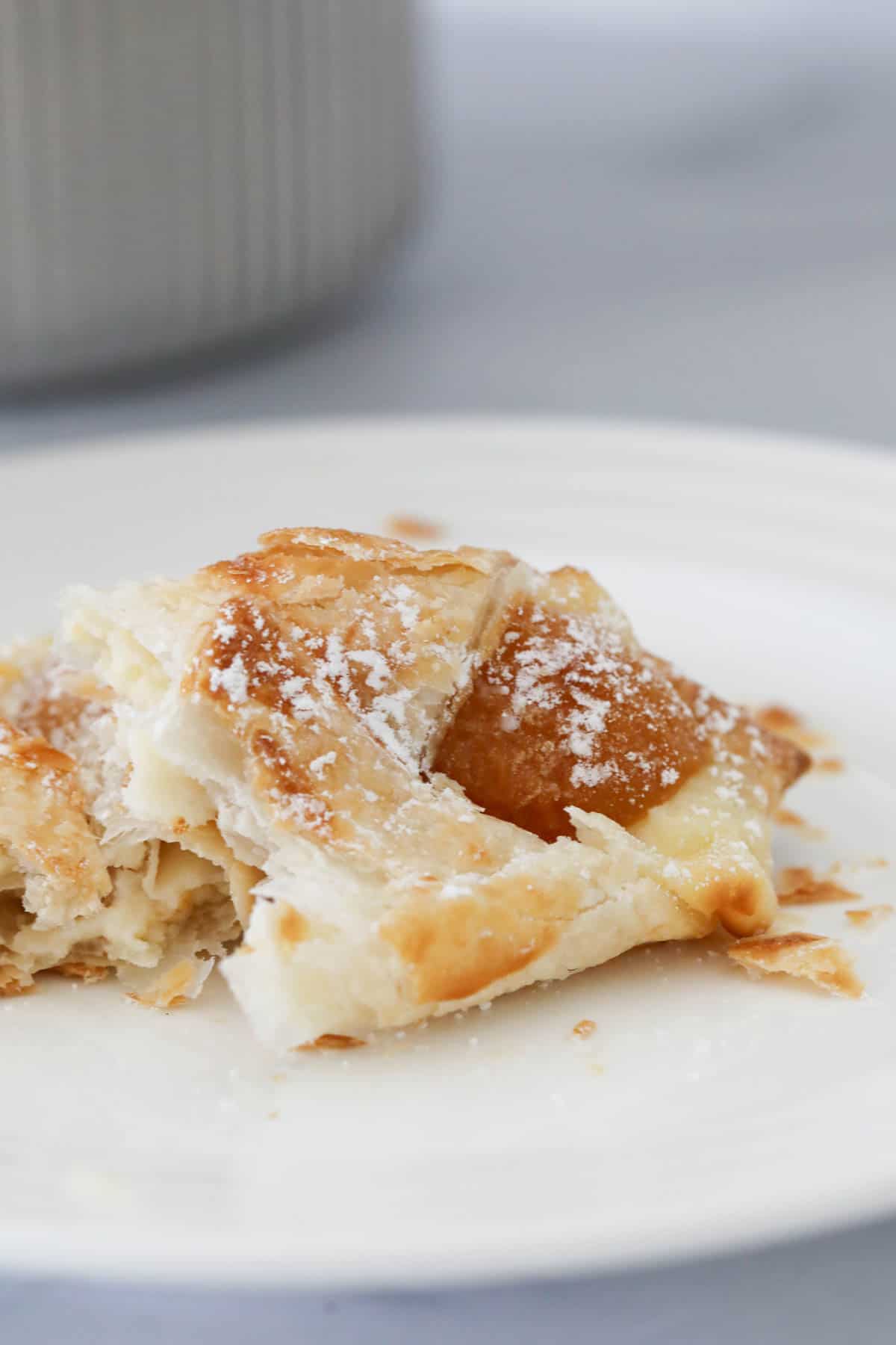 An apricot danish split to reveal the filling.