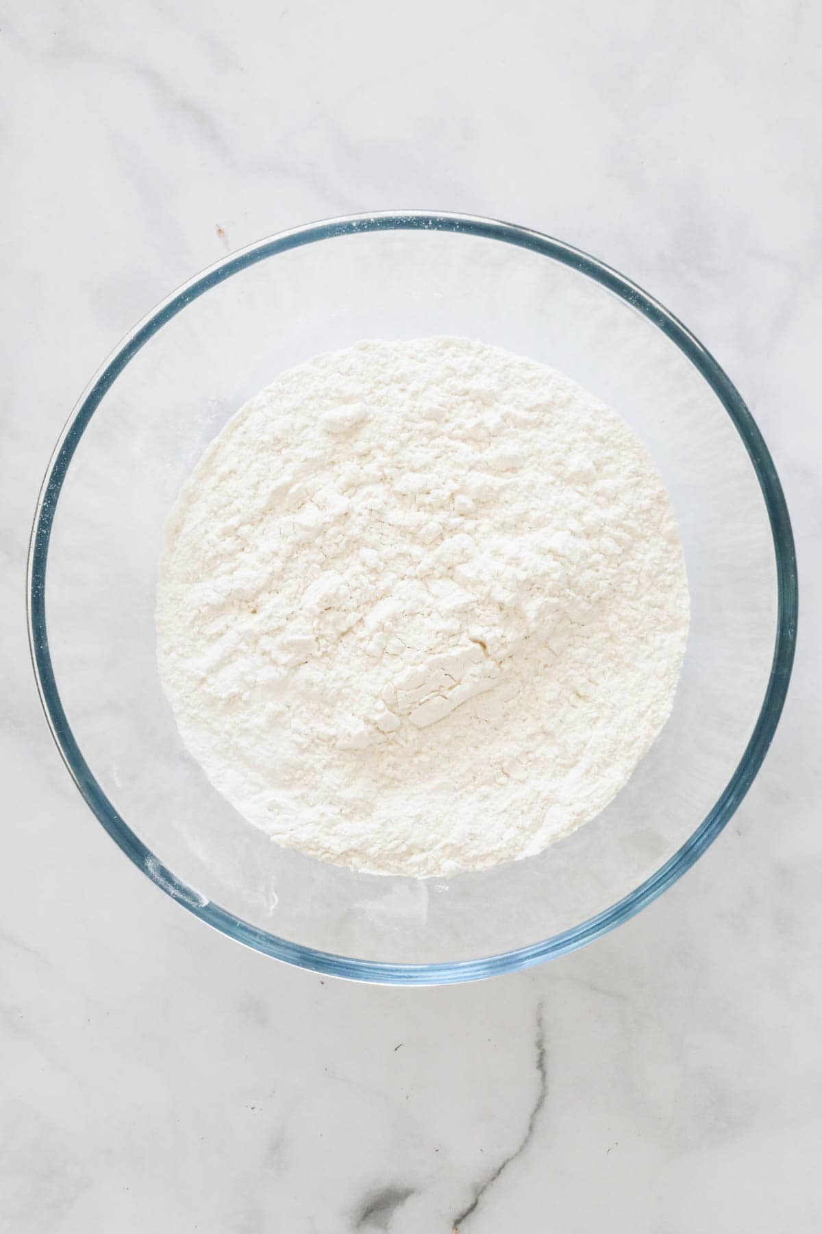 Plain flour and baking powder sifted into a large mixing bowl.