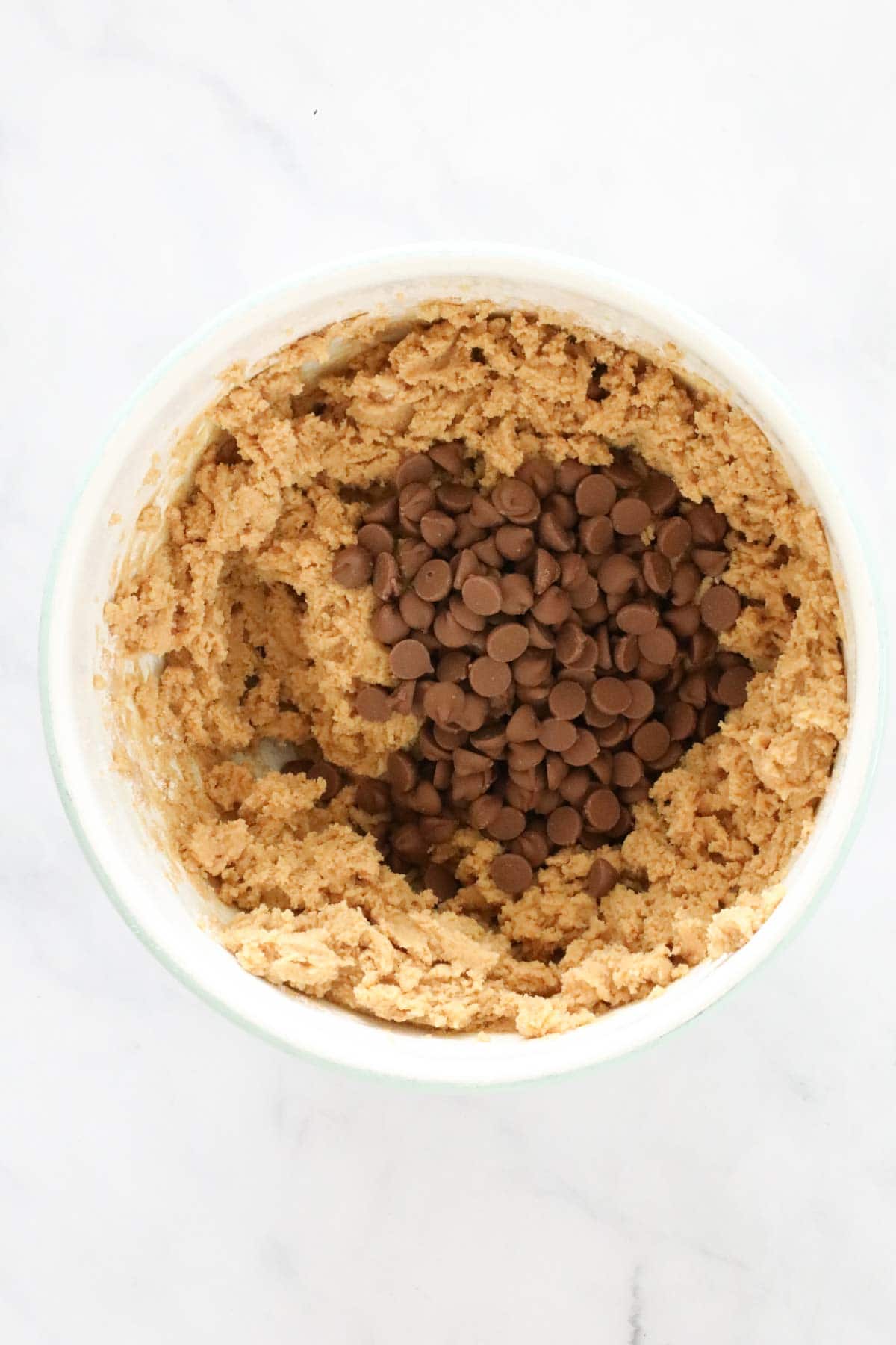 Chocolate chips added to the cookie dough mixture.