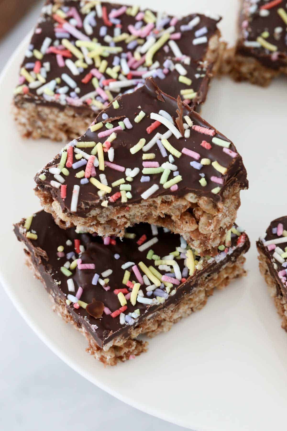 sprinkles on top of a chocolate slice.