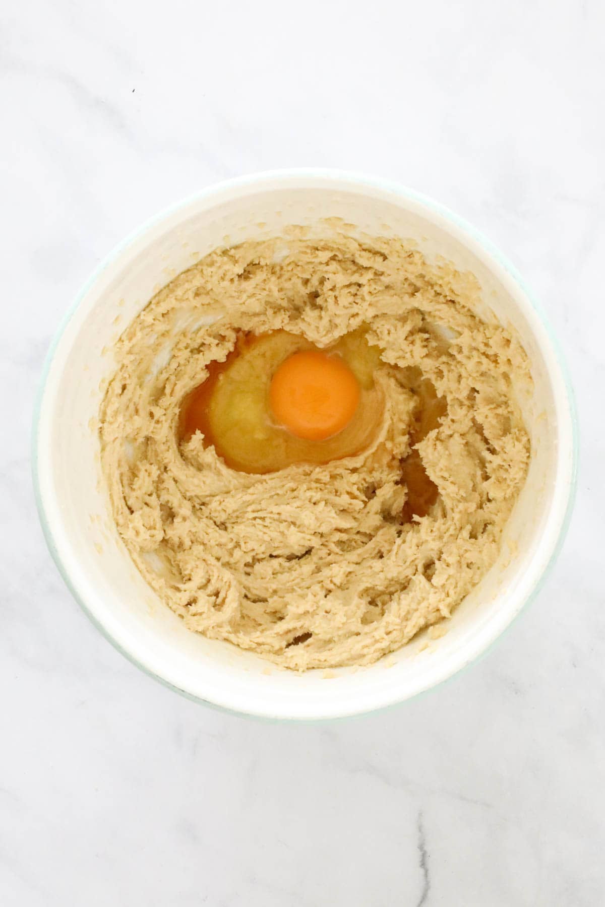 An egg added to creamed mixture.