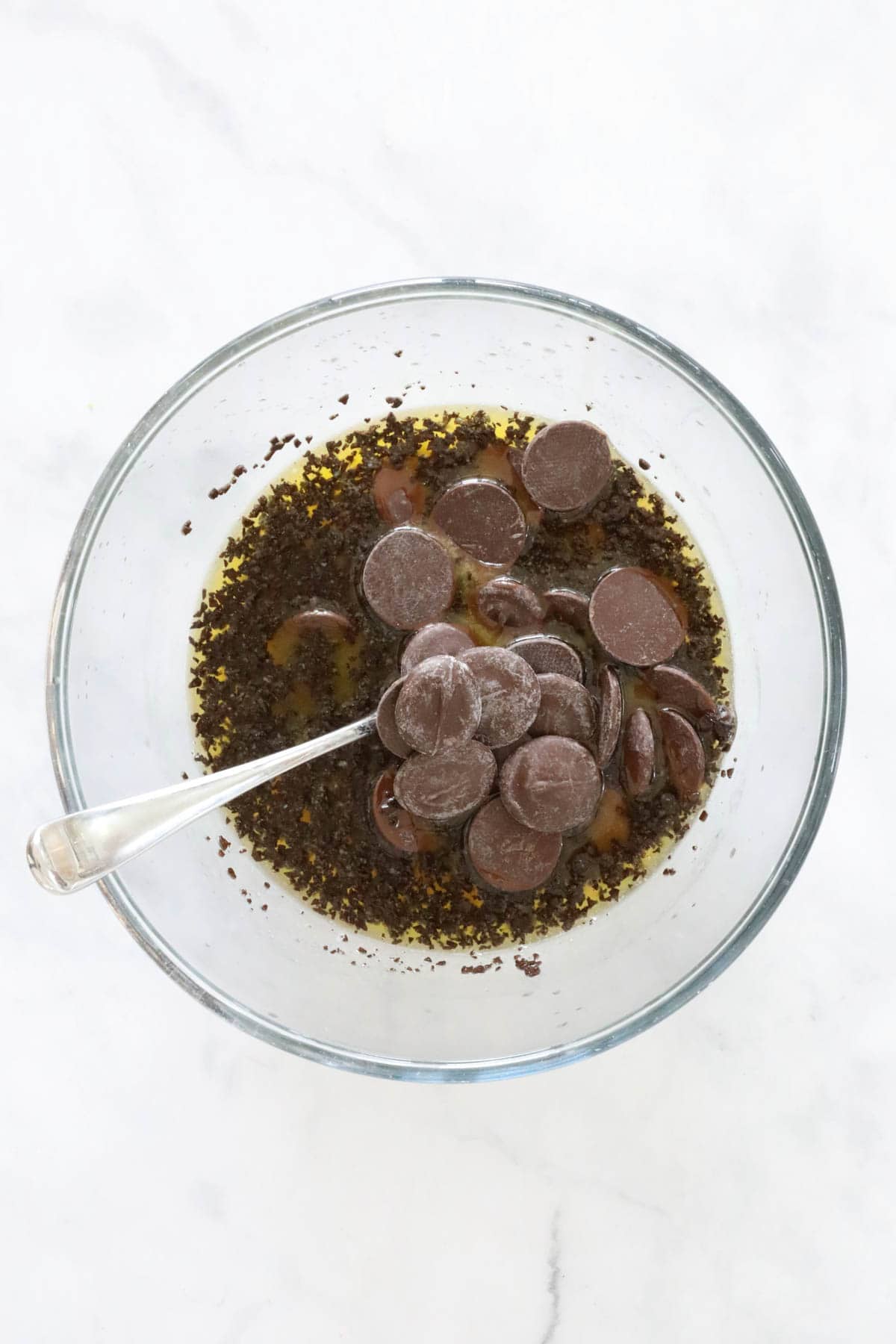 Chocolate melts added to the melted butter and espresso granules.