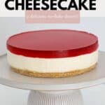 A jelly cheesecake on a cake stand.