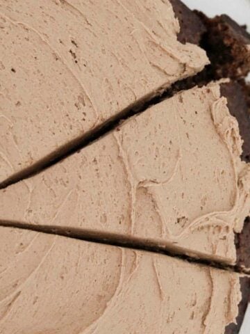 An overhead shot of a chocolate cake with buttercream icing.