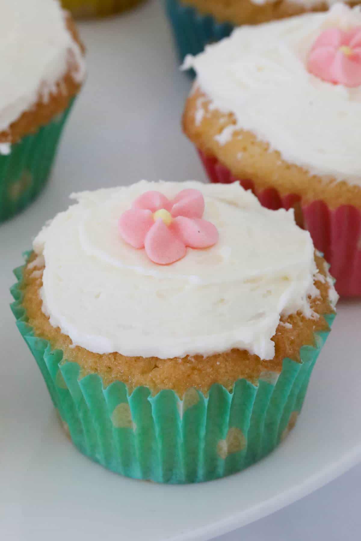 Close up of an iced mini cupcake.