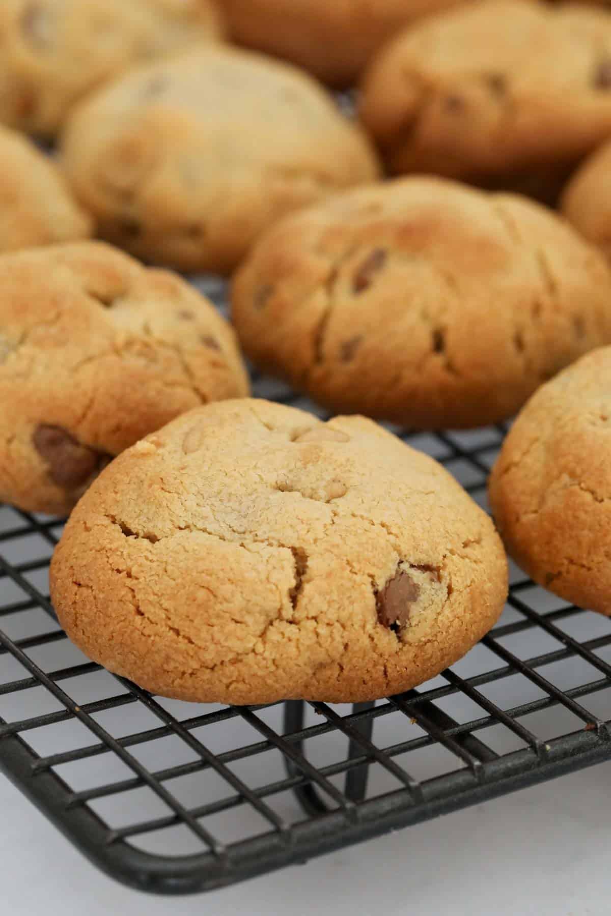 Baked cookies cooling on a wire cooling rack.