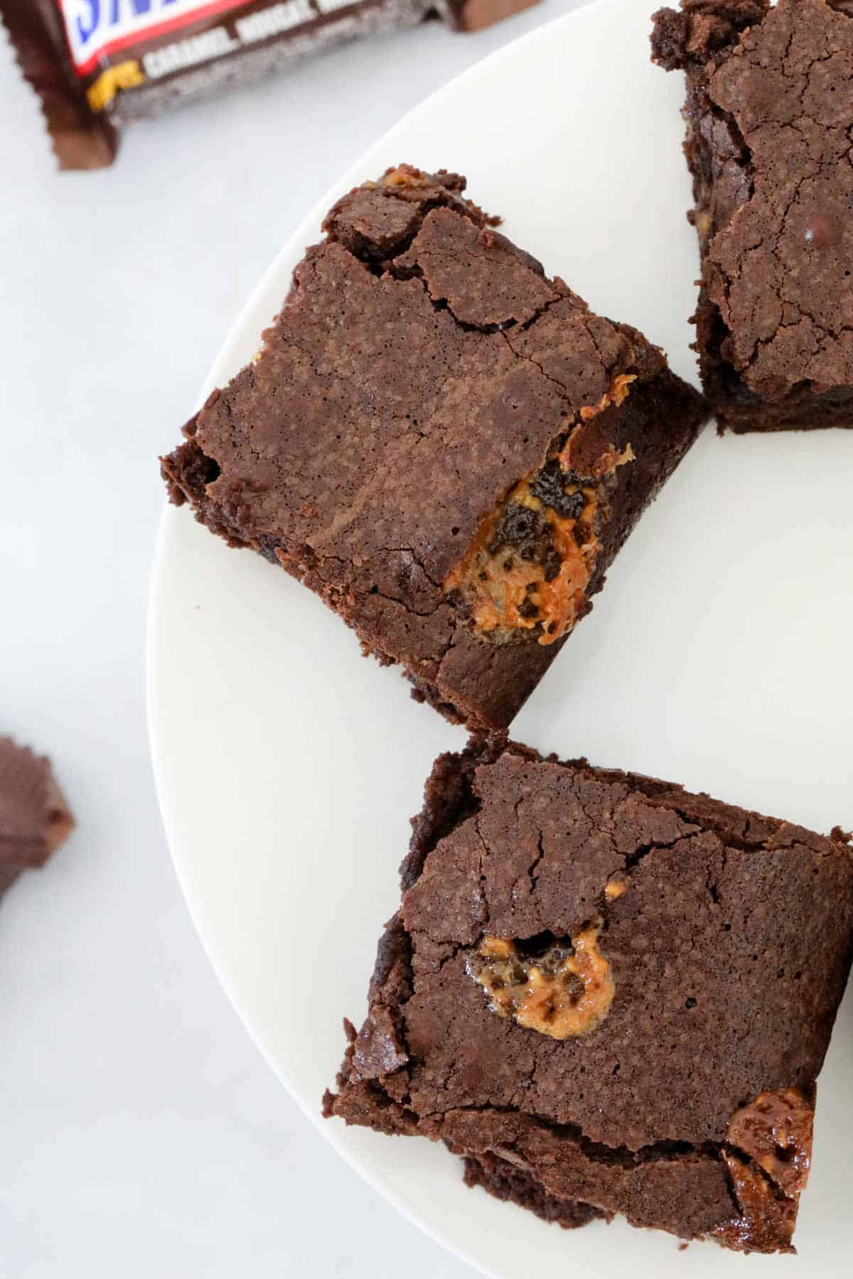 Overhead view of squares of the Snickers brownies.