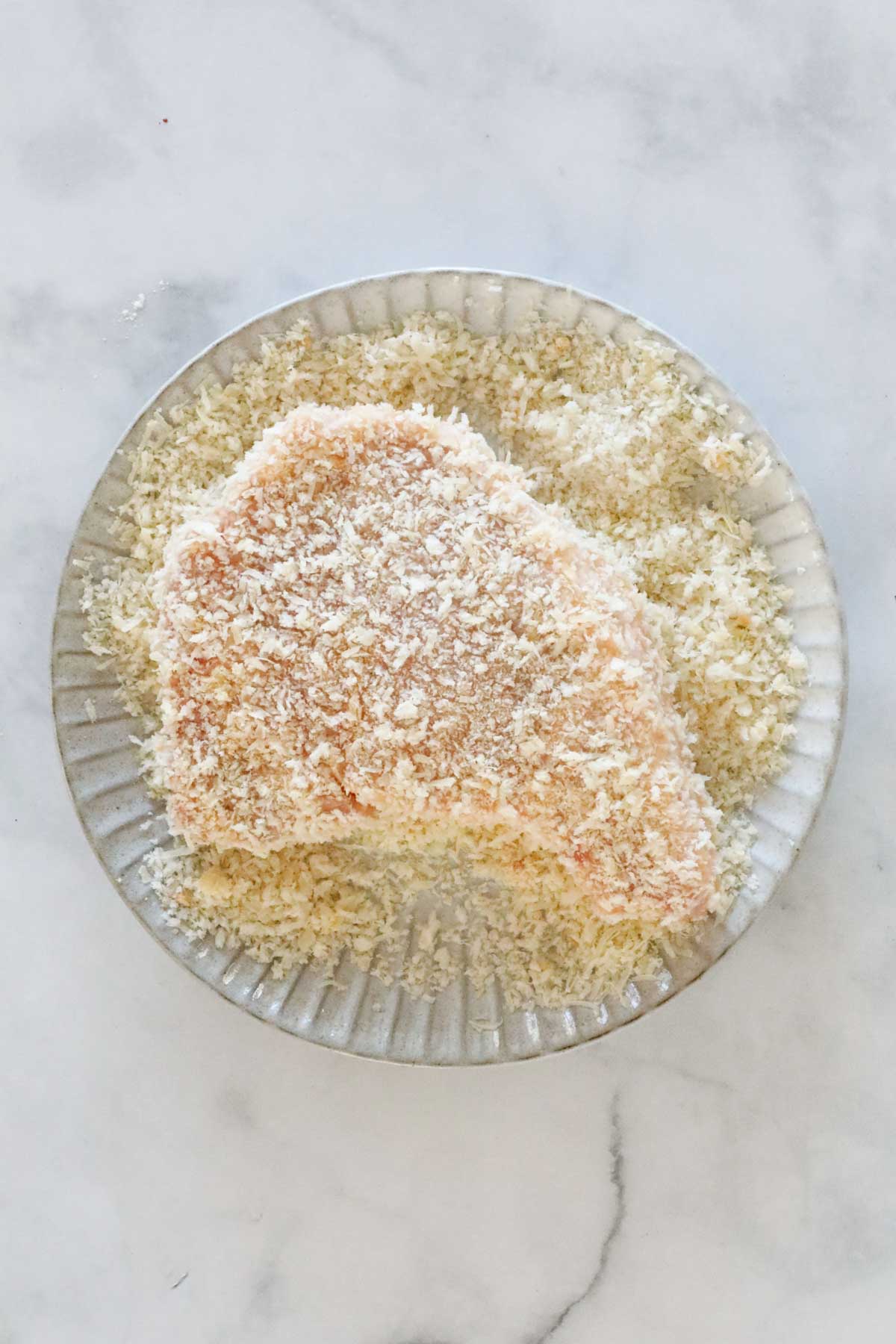 Pork chop covered in panko breadcrumbs.