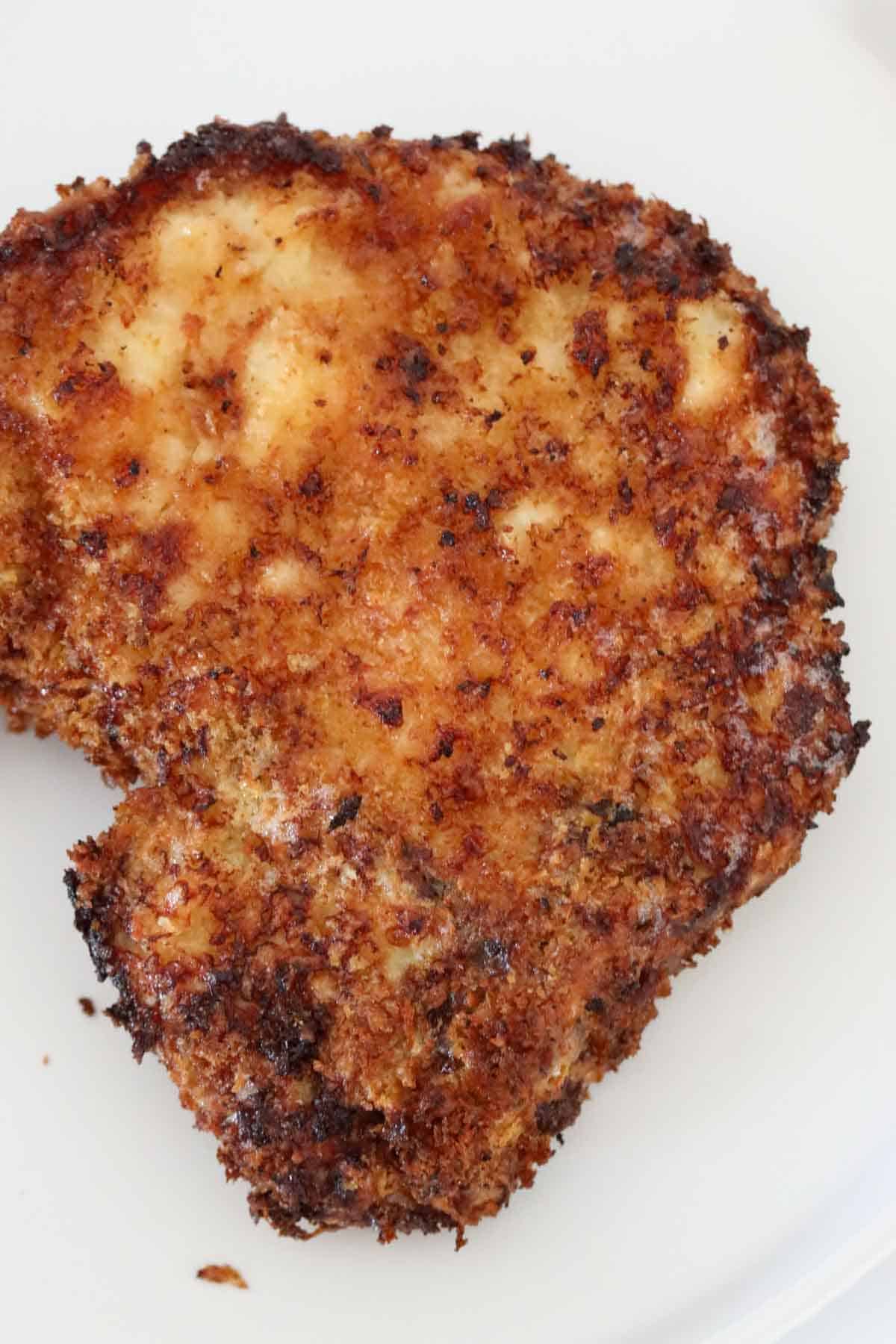 A crispy crumbed pork chop.