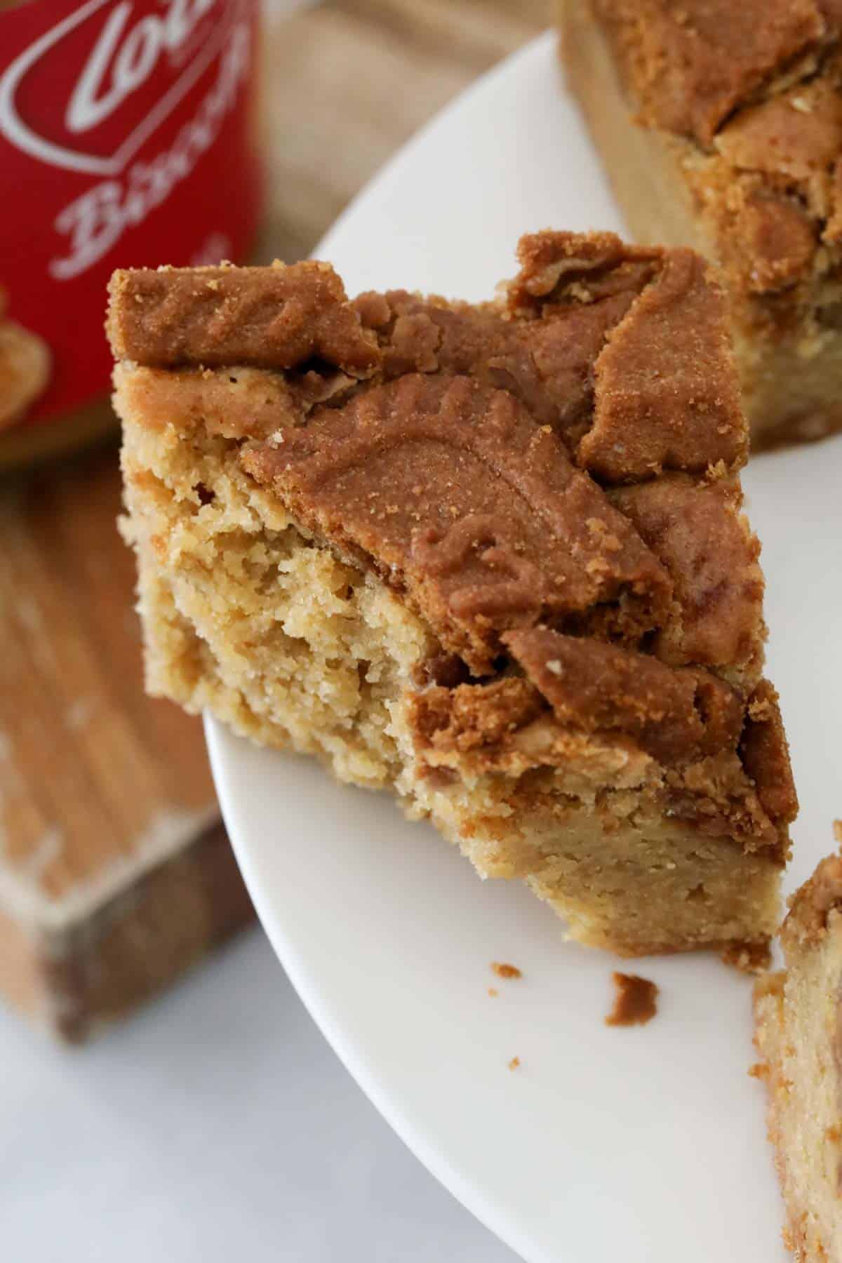 A close up of a half eaten piece of Biscoff Blondies.