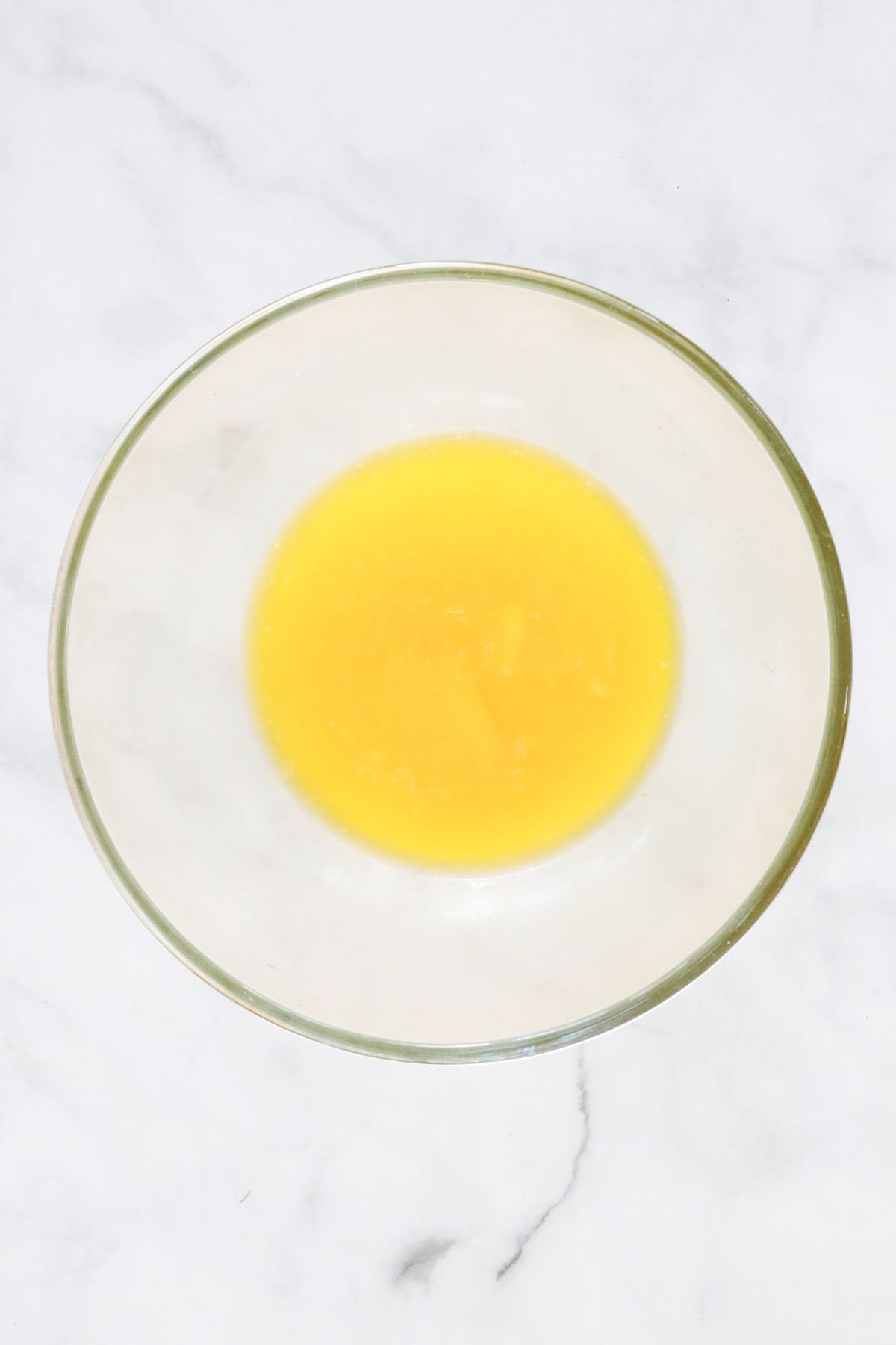 Butter melted in a glass bowl.