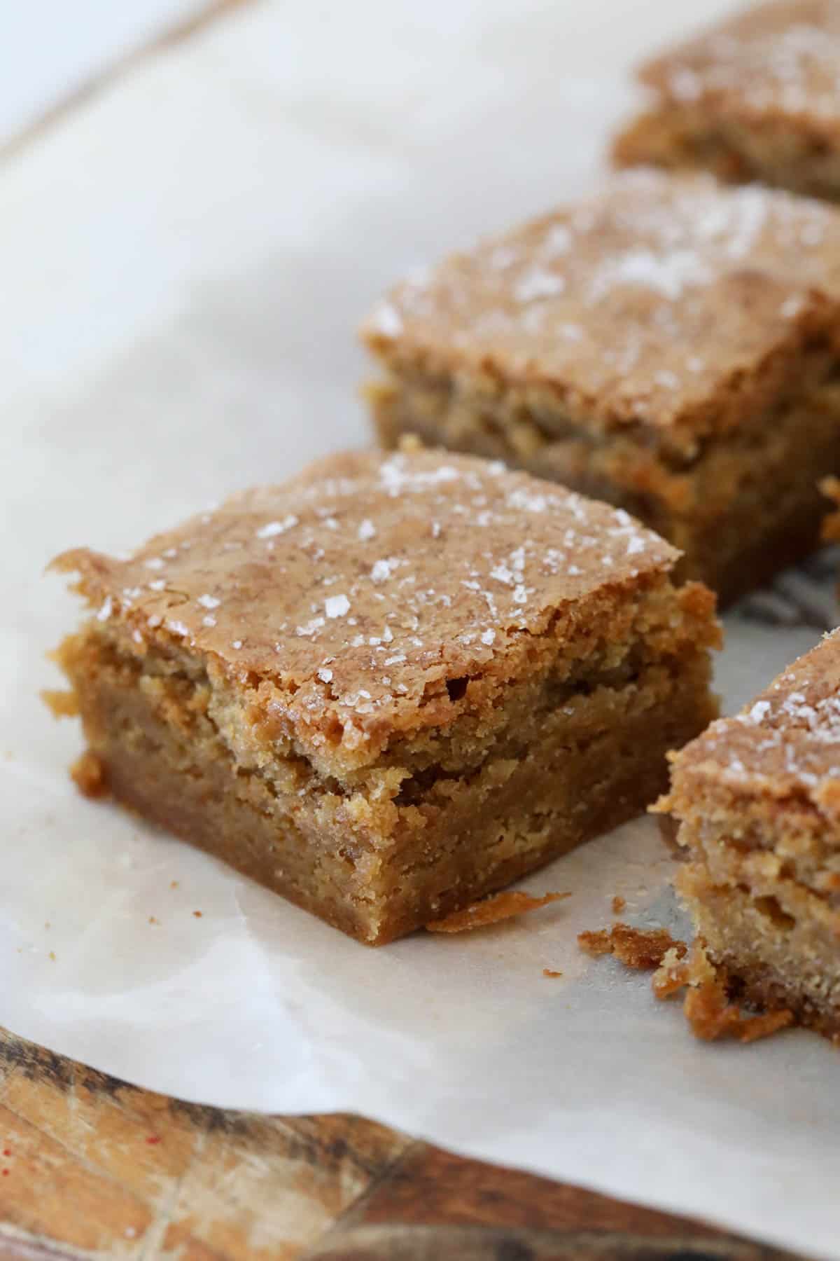 Cut blondies placed on baking paper.