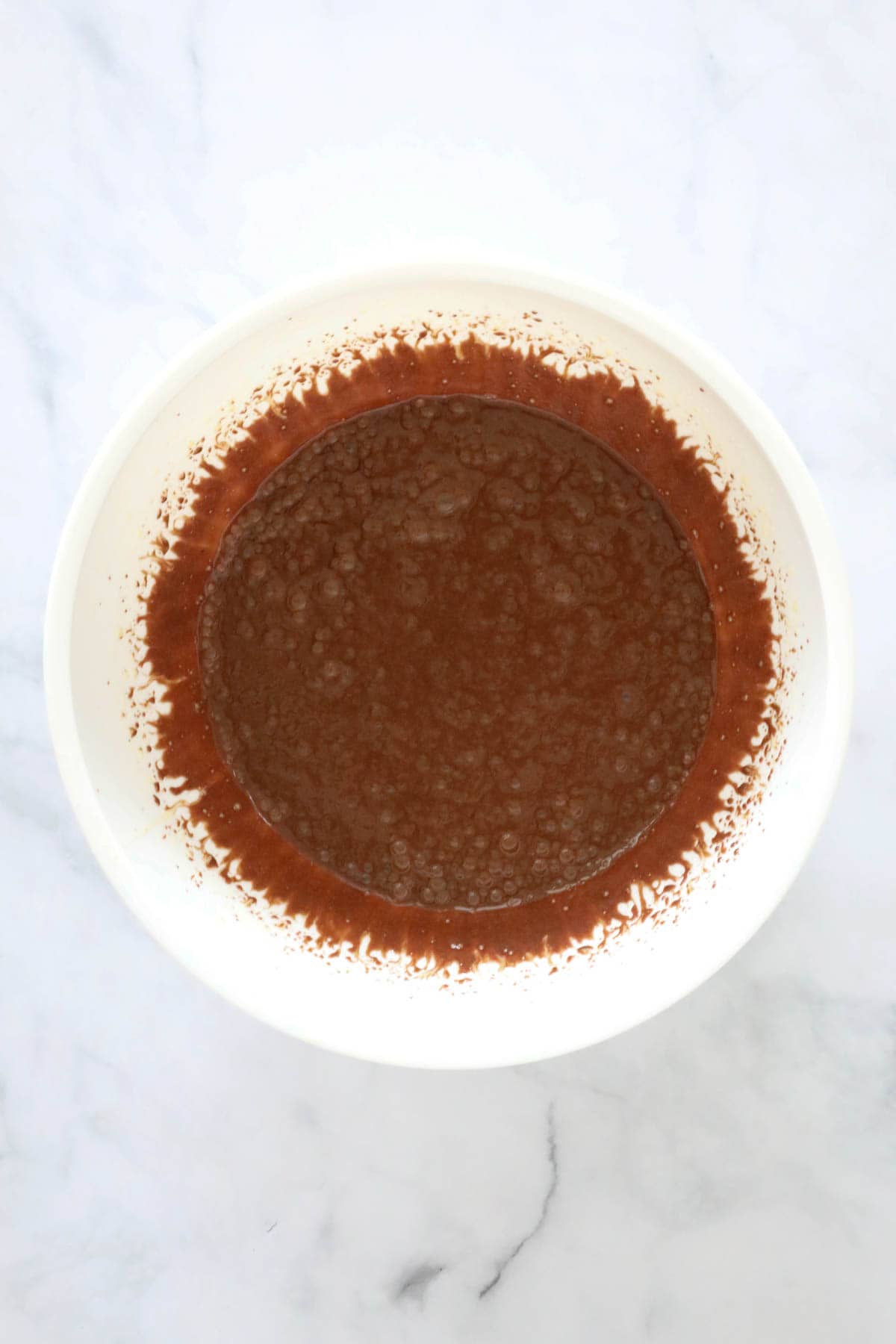 Cocoa mixture added to beaten sugar and eggs.