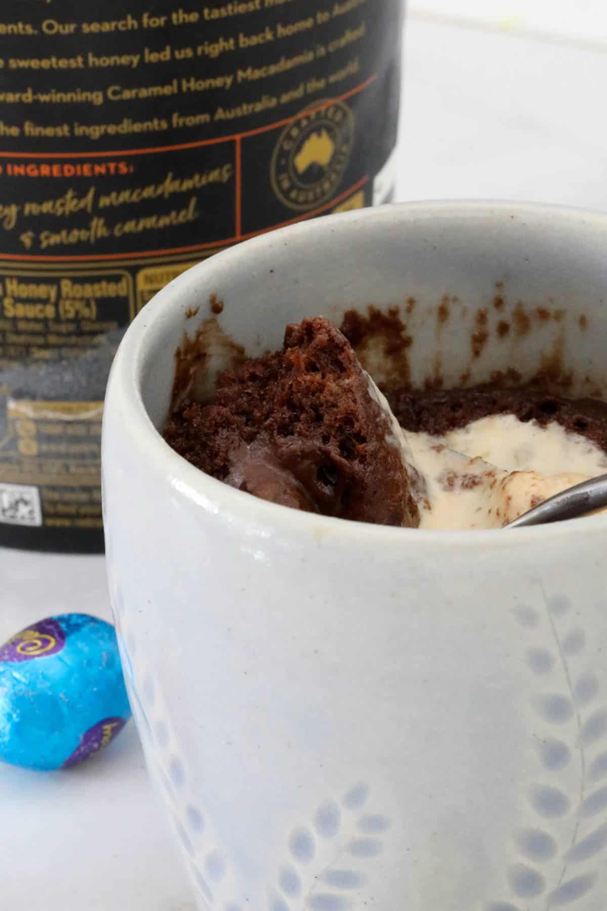 The cake with ice cream in a large white mug.